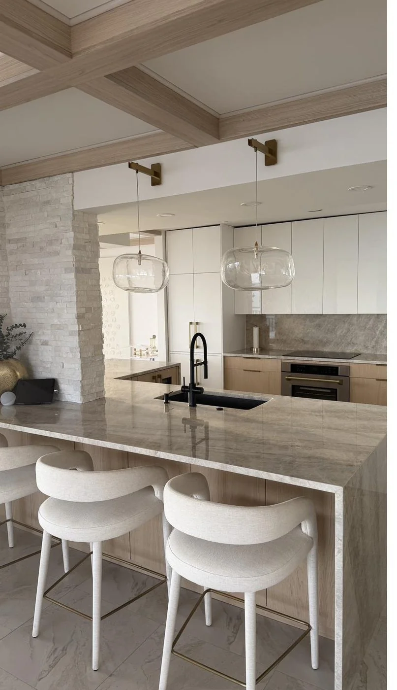 Albedo — marble island, oak and brass kitchen
